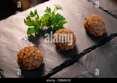 forefront of a group of crispy meatballs Stock Photo