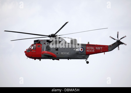 A Royal Navy Westland Sea King HU5 helicopter flying at the 2013 Sunderland International Airshow. Stock Photo