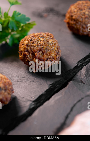 forefront of a group of crispy meatballs Stock Photo