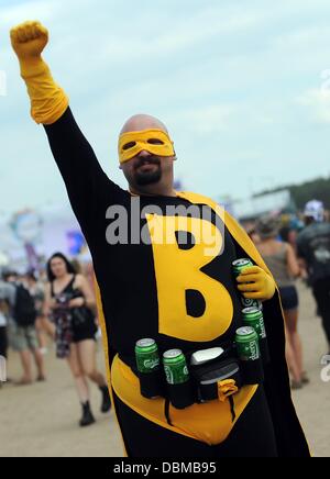 Kostrzyn, Poland. 01st Aug, 2013. People attend the music festival 'Przystanek Woodstock' in Kostrzyn, Poland, 01 August 2013. The motto of the festival is 'Love, Friendship and Music' and it is one of Europe's largest outdoor music festivals. Photo: BRITTA PEDERSEN/dpa/Alamy Live News Stock Photo