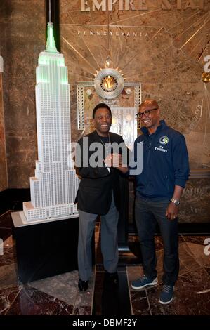 Manhattan, New York, USA. 1st Aug, 2013. New York Cosmos honorary President PELÉ, joined by MARCOS SENNA, ''flips the switch'' to light the Empire State Building's tower lights Cosmos green - to commemorate the return of the New York Cosmos to competitive play after 30 years, Thursday, August 1, 2013. Credit:  Bryan Smith/ZUMAPRESS.com/Alamy Live News Stock Photo