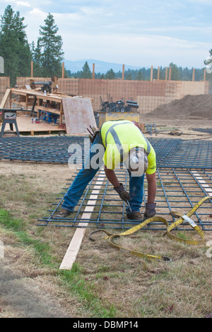 Construction worker handling rebar in Spokane, Washington State. Stock Photo