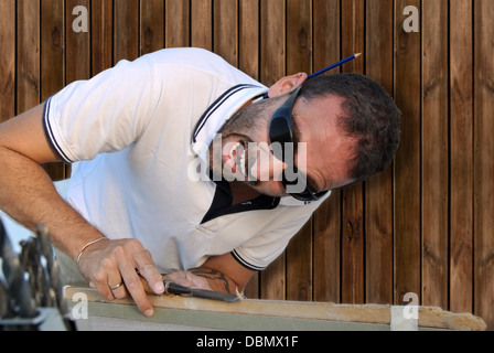 Carpenter crazy in shock with their work Stock Photo