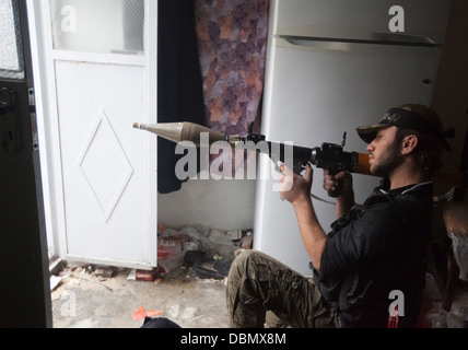 Aleppo, Syria: A Free Syrian Army member takes aim with a RPG rocket propelled grenade in Safa. Stock Photo