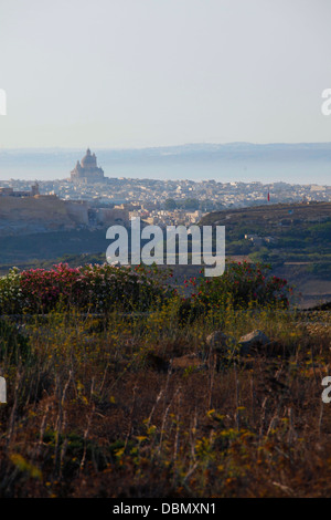 View of the citadel in Victoria and Rotunda church in the village of Xewkija from Ghammar hill in Gharb in Gozo island, the sister island of Malta Stock Photo