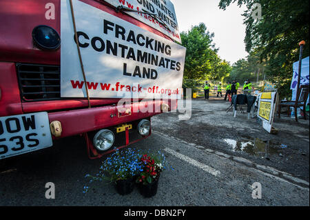 Balcombe, West Sussex, UK. 1st August 2013. The  gate is blocked early this morning by an old fire engine driven and then disabled by the Frack Fighters.  they are a group of environmental protestors and include Tamsin Omond. Anti fracking protestors continue their blockade of the Cuadrilla test drill near Balcombe, West Sussex, UK. 01 August 2013. Credit:  Guy Bell/Alamy Live News Stock Photo