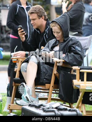 Jason Segel and Leslie Mann shooting a workout scene in a Santa Monica park while on the set of an untitled Judd Apatow project Los Angeles, California - 20.07.11 Stock Photo