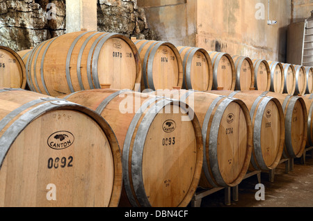 Row of Wooden Wine Barrels in the Cellers or Cave of Château Vignelaure Winery or Wine Estate Rians Provence France Stock Photo