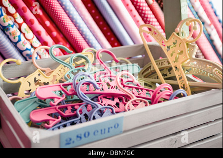 Clothes Hanger In A Box And Rolls Of Fabric, Munich, Bavaria, Germany, Europe Stock Photo