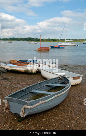 Small boats seen on and beside a river in south east England. Stock Photo