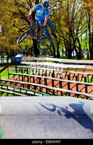 Teenager doing BMX bike stunt in skateboard park, Osijek, Croatia, Europe Stock Photo