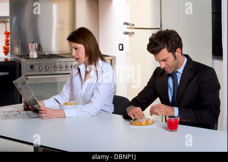 Couple having breakfast before going to work Stock Photo