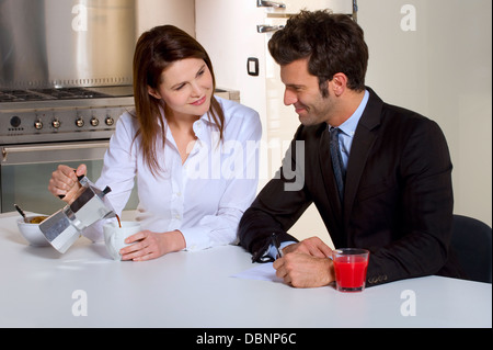 couple in the kitchen having breakfast Stock Photo