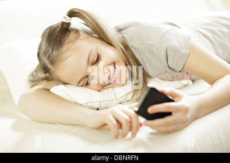 Girl using smart phone, Osijek, Croatia, Europe Stock Photo