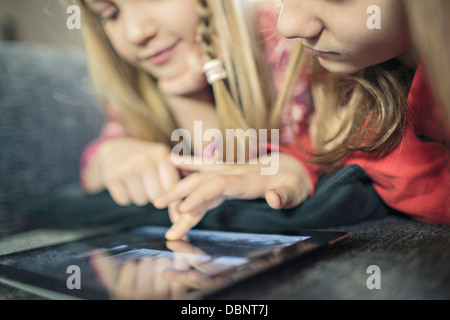 Two girls using digital tablet, Osijek, Croatia, Europe Stock Photo