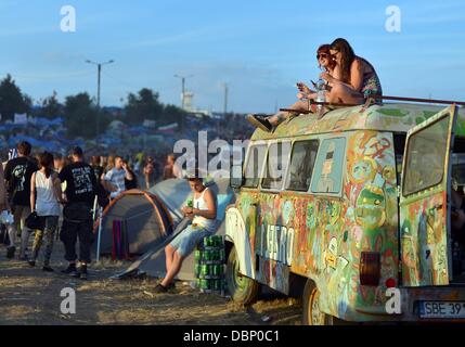 Kostrzyn, Poland. 01st Aug, 2013. People attend Przystanek Woodstock (Woodstock Station) in Kostrzyn, Poland, 01 August 2013. The festival's motto is 'Love, Friendship and Music' and is one of Europe's largest outdoor music festivals. Photo: Britta Pedersen/dpa/Alamy Live News Stock Photo