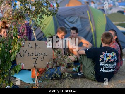 Kostrzyn, Poland. 01st Aug, 2013. People attend Przystanek Woodstock (Woodstock Station) in Kostrzyn, Poland, 01 August 2013. The festival's motto is 'Love, Friendship and Music' and is one of Europe's largest outdoor music festivals. Photo: Britta Pedersen/dpa/Alamy Live News Stock Photo