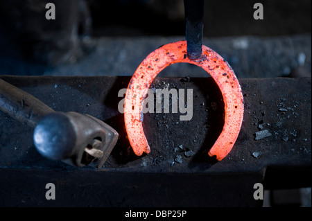 Sledgehammer and glowing horseshoe, Landshut, Bavaria, Germany Stock Photo