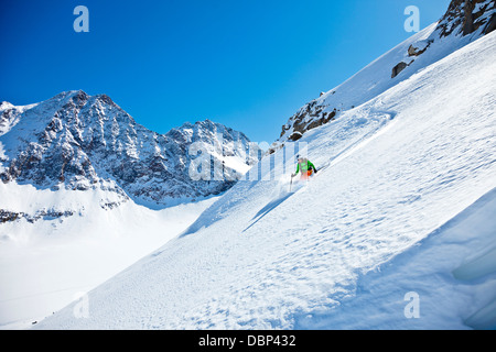 Female skier skiing downhill, Stubai, Tyrol, Austria Stock Photo