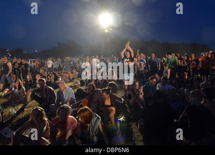 Kostrzyn, Poland. 01st Aug, 2013. People attend Przystanek Woodstock (Woodstock Station) in Kostrzyn, Poland, 01 August 2013. The festival's motto is 'Love, Friendship and Music' and is one of Europe's largest outdoor music festivals. Photo: Britta Pedersen/dpa/Alamy Live News Stock Photo