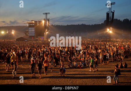 Kostrzyn, Poland. 01st Aug, 2013. People attend Przystanek Woodstock (Woodstock Station) in Kostrzyn, Poland, 01 August 2013. The festival's motto is 'Love, Friendship and Music' and is one of Europe's largest outdoor music festivals. Photo: Britta Pedersen/dpa/Alamy Live News Stock Photo