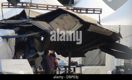 The Batplane is transported through a scene with a Batman figure in the cockpit on the set of the new Batman film 'Dark Knight Rises' filming in Pittsburgh  Pennsylvania, USA - 14.08.11 Stock Photo