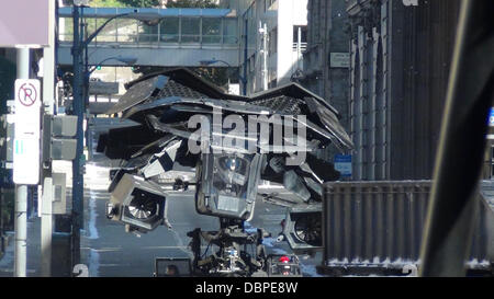 The Batplane is transported through a scene with a Batman figure in the cockpit on the set of the new Batman film 'Dark Knight Rises' filming in Pittsburgh  Pennsylvania, USA - 14.08.11 Stock Photo