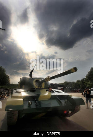 HOMEMADE TANK TAKES TO THE STREETS Residents of Hangzhou, China, may have had cause for alarm when they stepped outside to see a T60 tank rolling through the streets but the 10 ton vehicle was in fact a homemade full-scale replica of the killing machine. The tank took a team of a dozen workers seven months to make and at 6.24m x 3.27m can reach a top speed of 15 mph. The owner plan Stock Photo