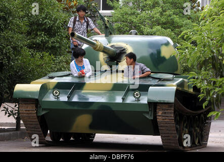 HOMEMADE TANK TAKES TO THE STREETS Residents of Hangzhou, China, may have had cause for alarm when they stepped outside to see a T60 tank rolling through the streets but the 10 ton vehicle was in fact a homemade full-scale replica of the killing machine. The tank took a team of a dozen workers seven months to make and at 6.24m x 3.27m can reach a top speed of 15 mph. The owner plan Stock Photo