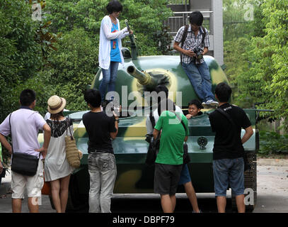 HOMEMADE TANK TAKES TO THE STREETS Residents of Hangzhou, China, may have had cause for alarm when they stepped outside to see a T60 tank rolling through the streets but the 10 ton vehicle was in fact a homemade full-scale replica of the killing machine. The tank took a team of a dozen workers seven months to make and at 6.24m x 3.27m can reach a top speed of 15 mph. The owner plan Stock Photo