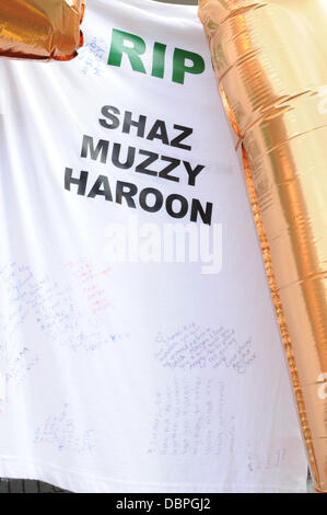 Tributes mark the spot where Haroon Jahan, Shahzad Ali and Abdul Musavir died after being hit by a car on 10 August during the riots in the Winson Green area of Birmingham Birmingham, England - 17.08.11 Stock Photo