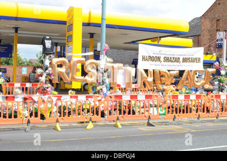 Tributes mark the spot where Haroon Jahan, Shahzad Ali and Abdul Musavir died after being hit by a car on 10 August during the riots in the Winson Green area of Birmingham Birmingham, England - 17.08.11 Stock Photo