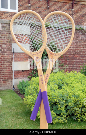 A pair of Royal Tennis racquets outside the Royal Tennis Court at Hampton Court Palace, Richmond Upon Thames, UK. Stock Photo