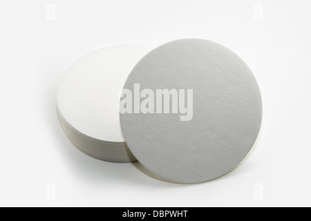 Stack of new beer coasters isolated on a white background.  Add your own design or logo. Stock Photo