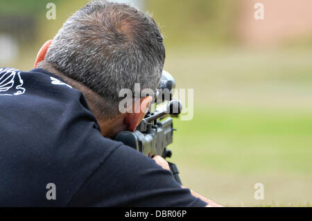 Ballykinlar, Northern Ireland. 2nd August 2013 - A man fires a Remington 700P bolt-action sniper rifle Credit:  Stephen Barnes/Alamy Live News Stock Photo