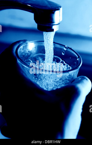 take water in glass from water wet Stock Photo