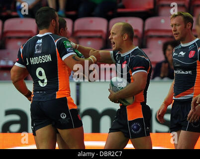 Wigan, UK. 02nd Aug, 2013. Michael Dobson of Hull KR dives across the line to score a try and then celebrates during the Rugby Super League fixture between Wigan Warriors and Hull Kingston Rovers from the DW Stadium. Credit:  Action Plus Sports/Alamy Live News Stock Photo