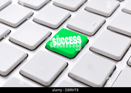 Green success button on the computer keyboard Stock Photo