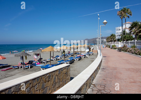 The Playa El Chucho beach in Nerja Spain on the Costa Del Sol Stock Photo