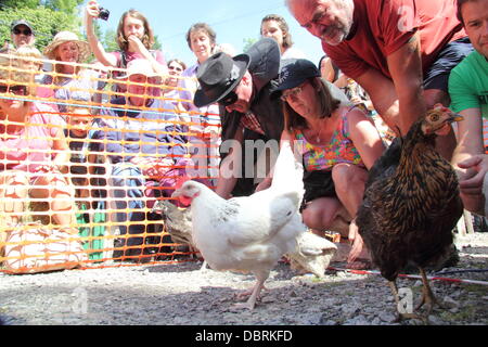 Competitors & their fowl at The Hen Racing World Championships outside Barley Mow Pub, Bonsall, Peak District Derbyshire, UK Stock Photo