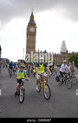 London, UK. 3rd August, 2013. Prudential RideLondon Freecycle attended by whole families have the opportunity to have fun and freedom of cycling around the circumference of eight miles of traffic in central London. Stock Photo