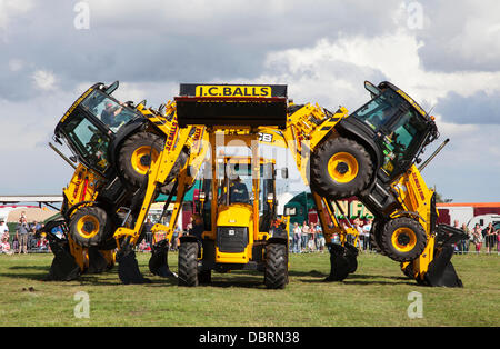 Brackenfield, Derbyshire, U.K. 3rd August 2013. The J.C. Balls Digger Dance Team perform at the 2013 Cromford Steam Rally. The annual steam event is in its 43rd year since the society was formed in 1970. The Digger Dance team have been performing since 2004. Their routine is choreographed to music and includes a number of exceptionally daring manoeuvres. Credit:  Mark Richardson/Alamy Live News Stock Photo