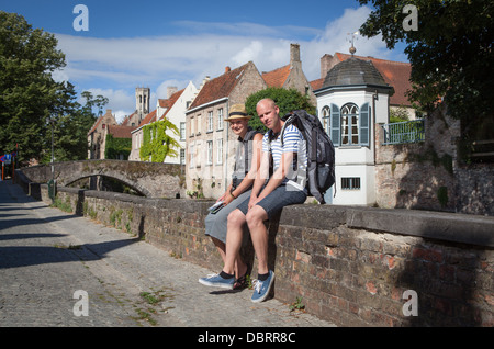 Young backpackers in the historical city of Bruges in Belgium Stock Photo