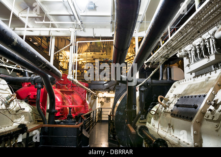 A section of the giant steam engine in the underbelly of the historic Queen Mary in Long Beach, California. Stock Photo