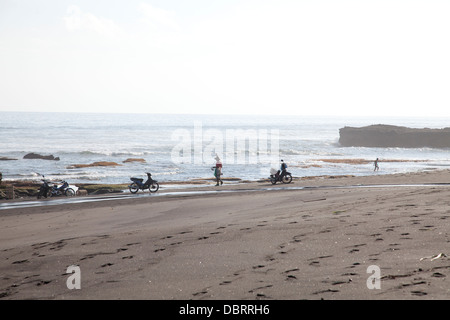 Fisherman On Kelecung Beach / Black Sand, Tabanan, Bali, Indonesia Stock Photo