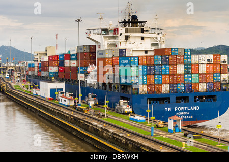 Panama Canal Panama Container ship YM Portland transits the Miraflores locks Stock Photo