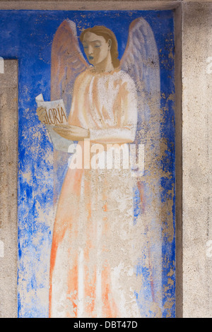 Painting of an angel on the church in the new village of Oradour-sur-Glane. Stock Photo