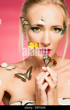 Portrait of a beautiful woman with butterflies Stock Photo
