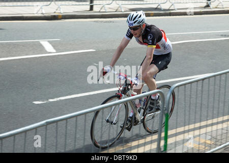 Wimbledon London, UK. 4th Aug,2013. Cyclists take part in the London-surrey 100 ride passing through Wimbledon village. Up to 20,000 cyclists are expected to ride the 100 mile route through south west London and Surrey Credit:  amer ghazzal/Alamy Live News Stock Photo