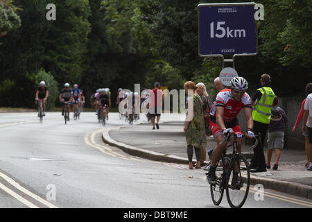 Wimbledon London, UK. 4th Aug,2013. Cyclists take part in the London-surrey 100 ride passing through Wimbledon village. Up to 20,000 cyclists are expected to ride the 100 mile route through south west London and Surrey Credit:  amer ghazzal/Alamy Live News Stock Photo